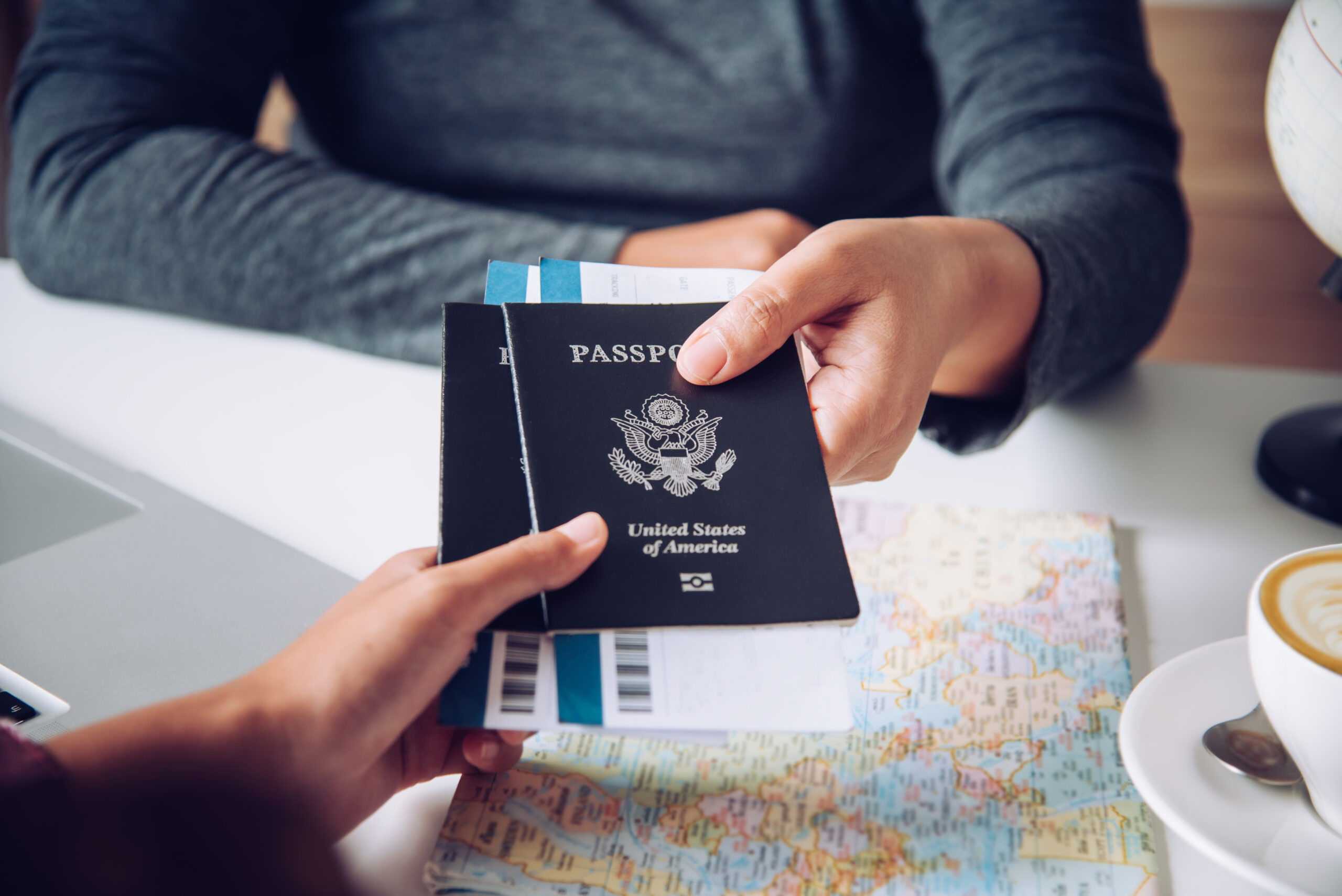 Hand for tourist holding passport to authorities